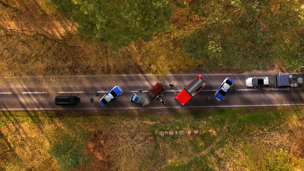 Traffic accident with vehicles on a highway aerial view